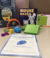 Coding Mouse Kit contents: mouse robot, books, cards, guide.